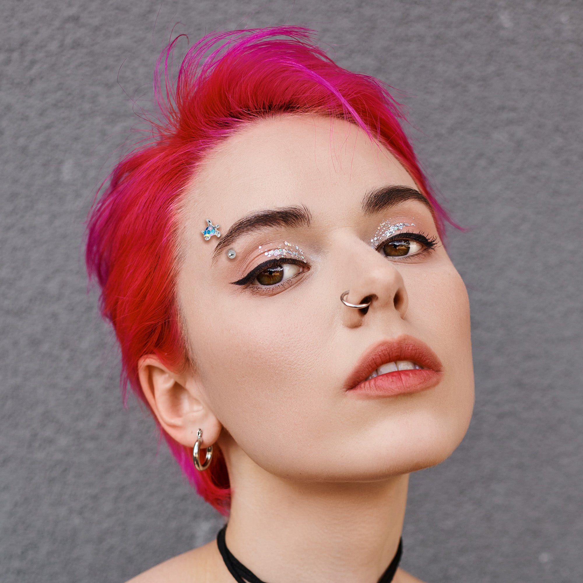 Curved Eyebrow Ring Featuring Glittery Turtle - 16 Gauge