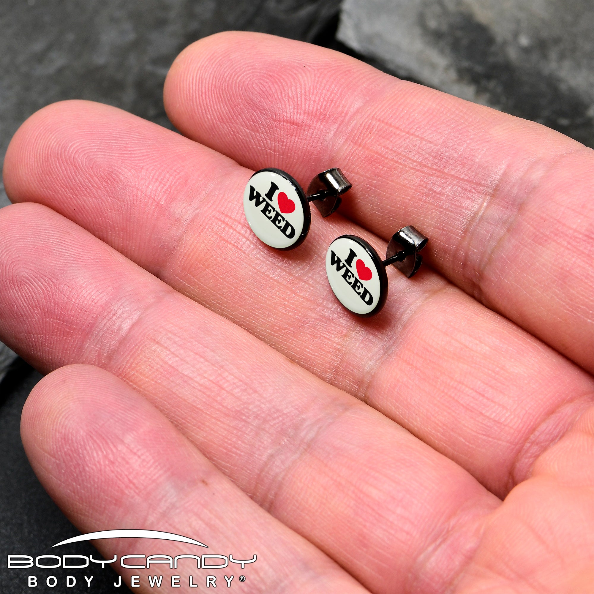 Glow in the dark weed-themed stud earrings, black anodized