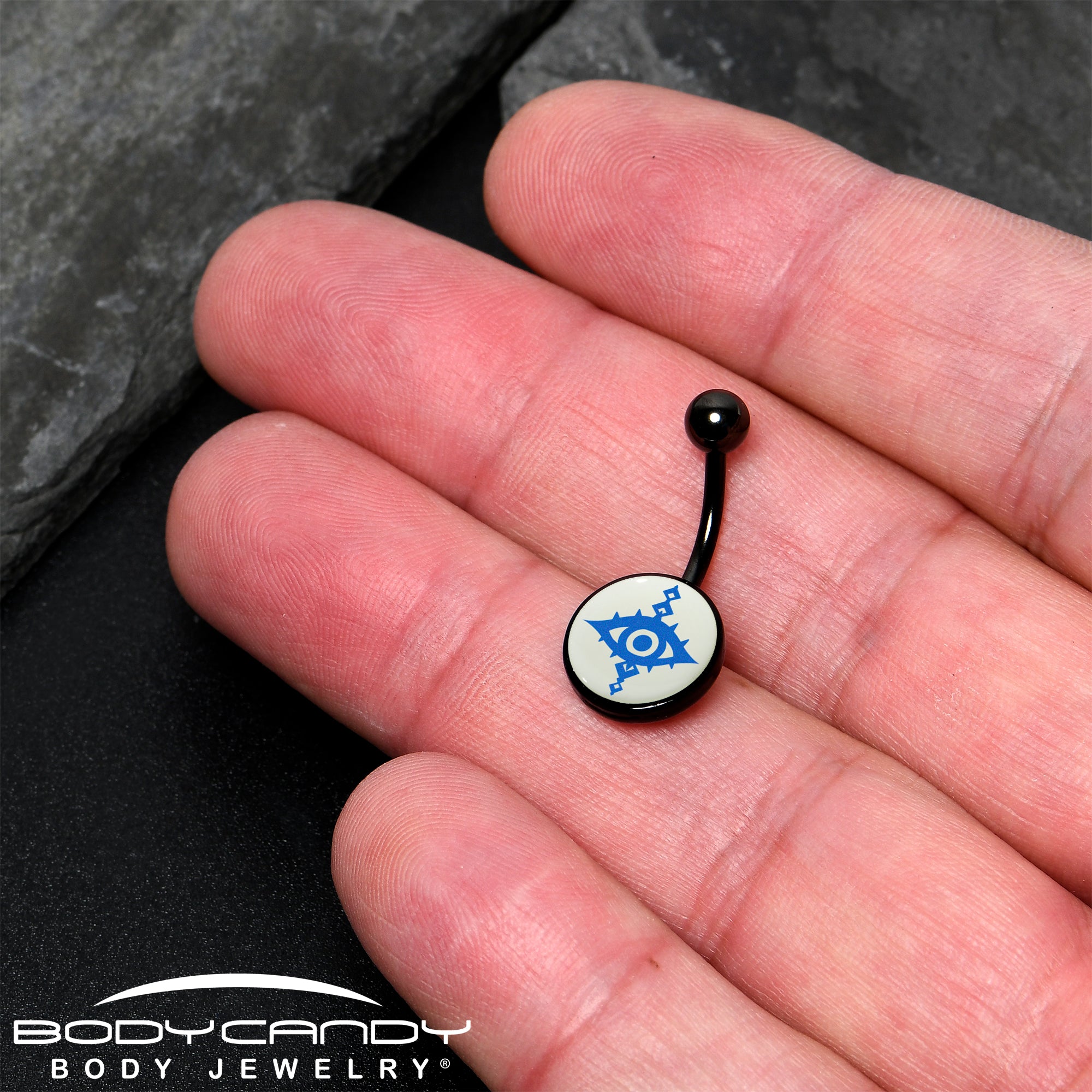 Evil eye belly ring in black anodized finish with glow-in-the-dark feature