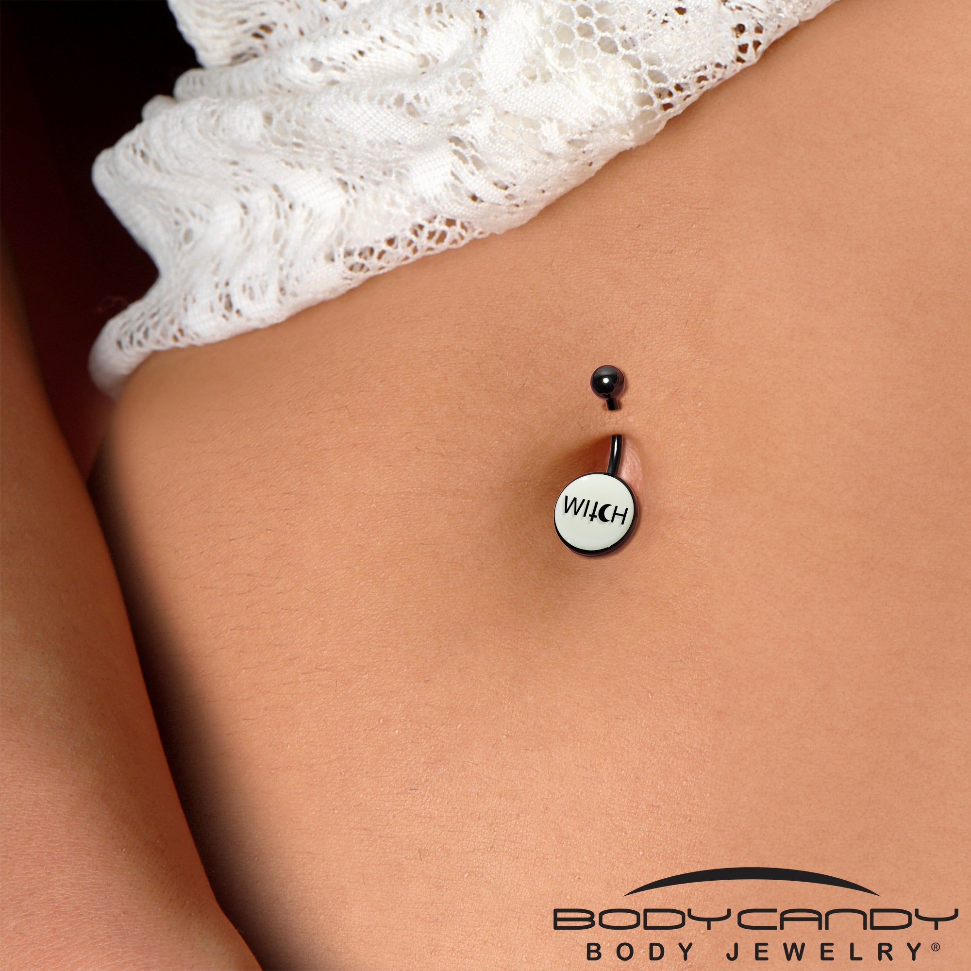 Witch-themed glow in the dark belly button ring