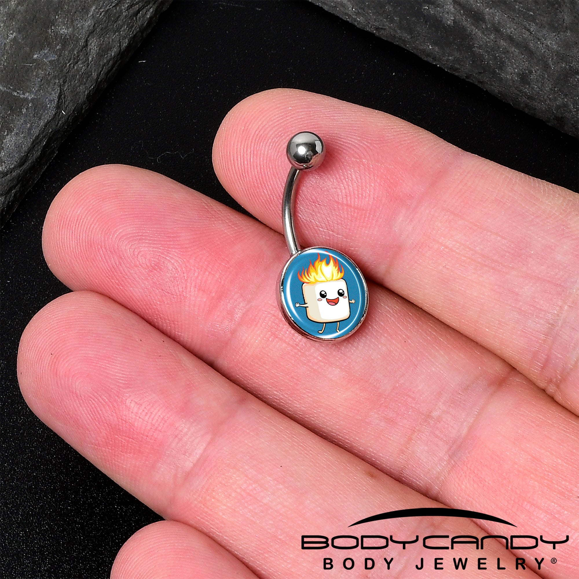 Unique belly ring featuring a marshmallow on fire