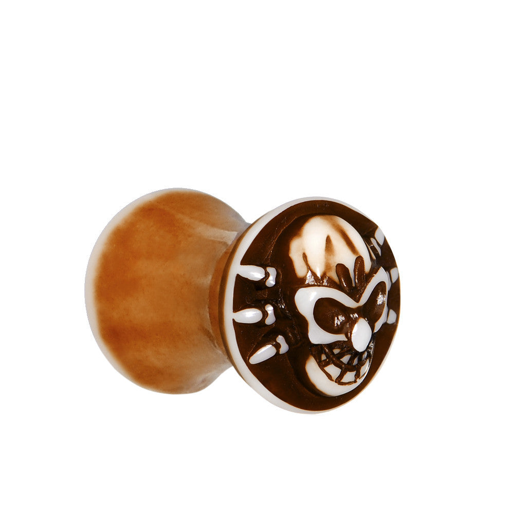 2 Gauge Brown White Resin Skull Saddle Plug