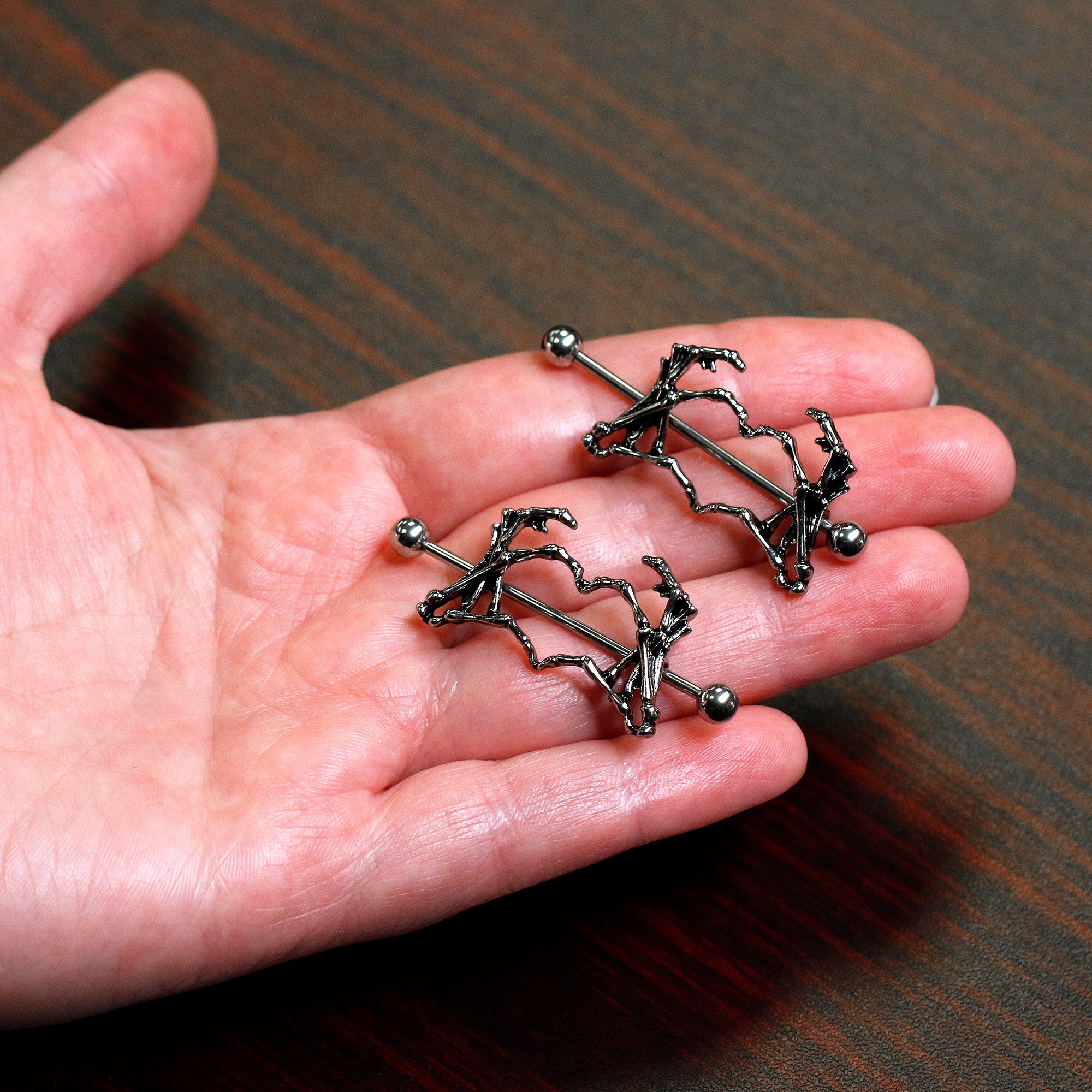 Skull hand online nipple rings