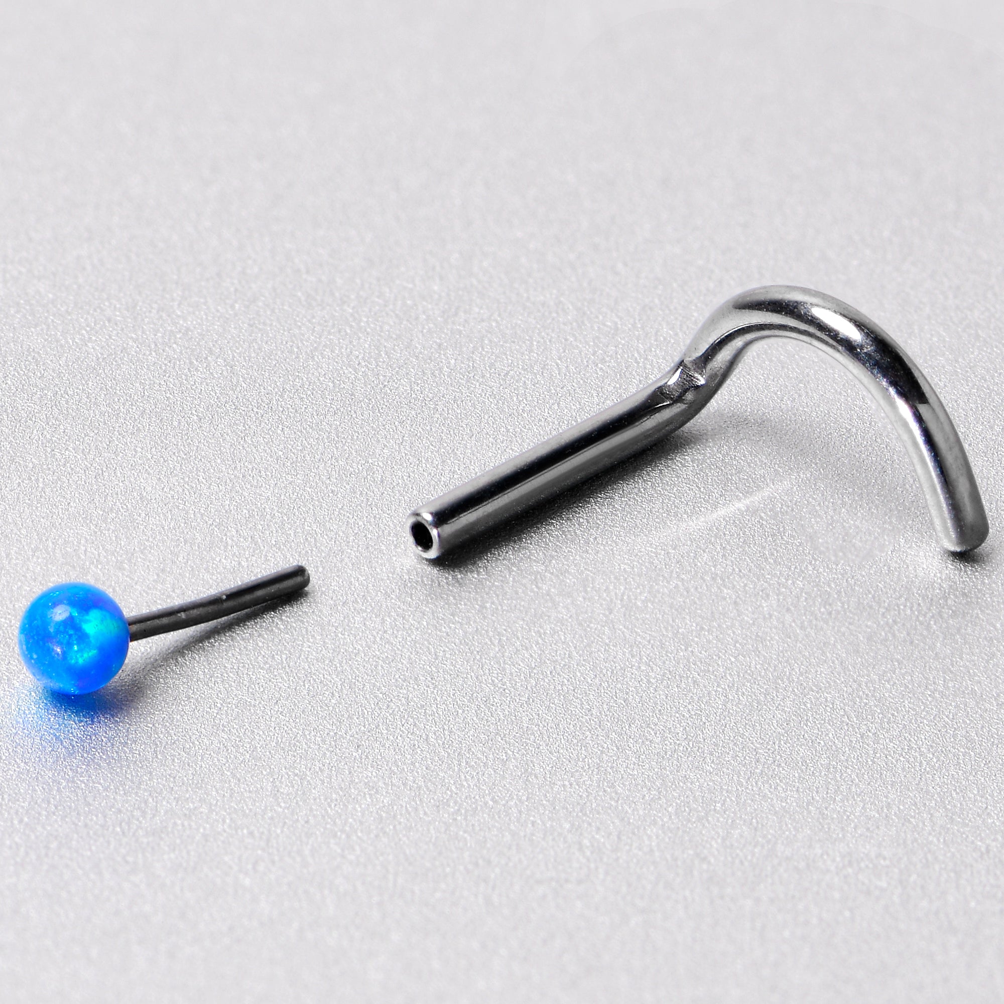 18 Gauge 1/4 Blue Synth Opal G23 Titanium Threadless Left Nose Screw