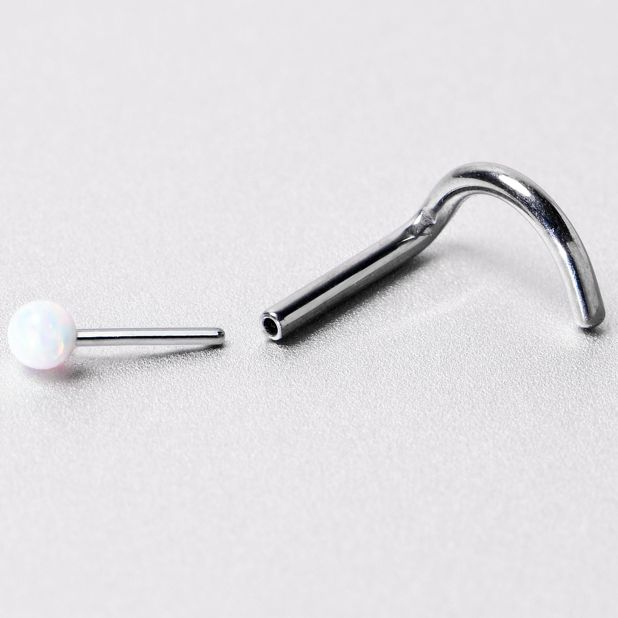 18 Gauge 1/4 White Synth Opal G23 Titanium Threadless Left Nose Screw