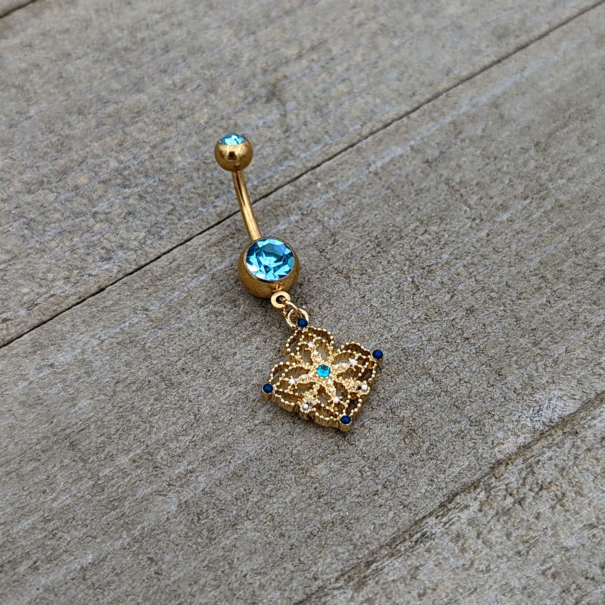 Blue Gem Gold Tone Texture Emblem Dangle Belly Ring