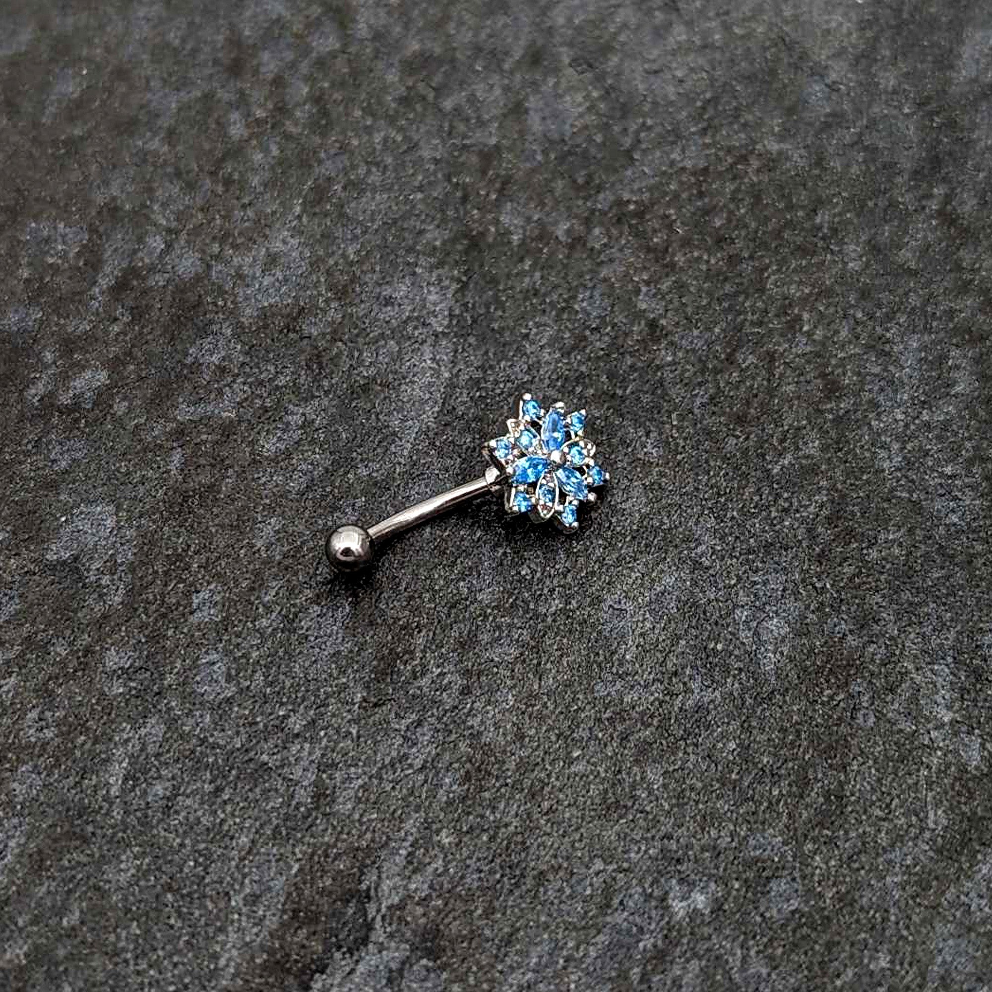 16 Gauge 5/16 Blue CZ Gem Snowflake Blues Curved Eyebrow Ring