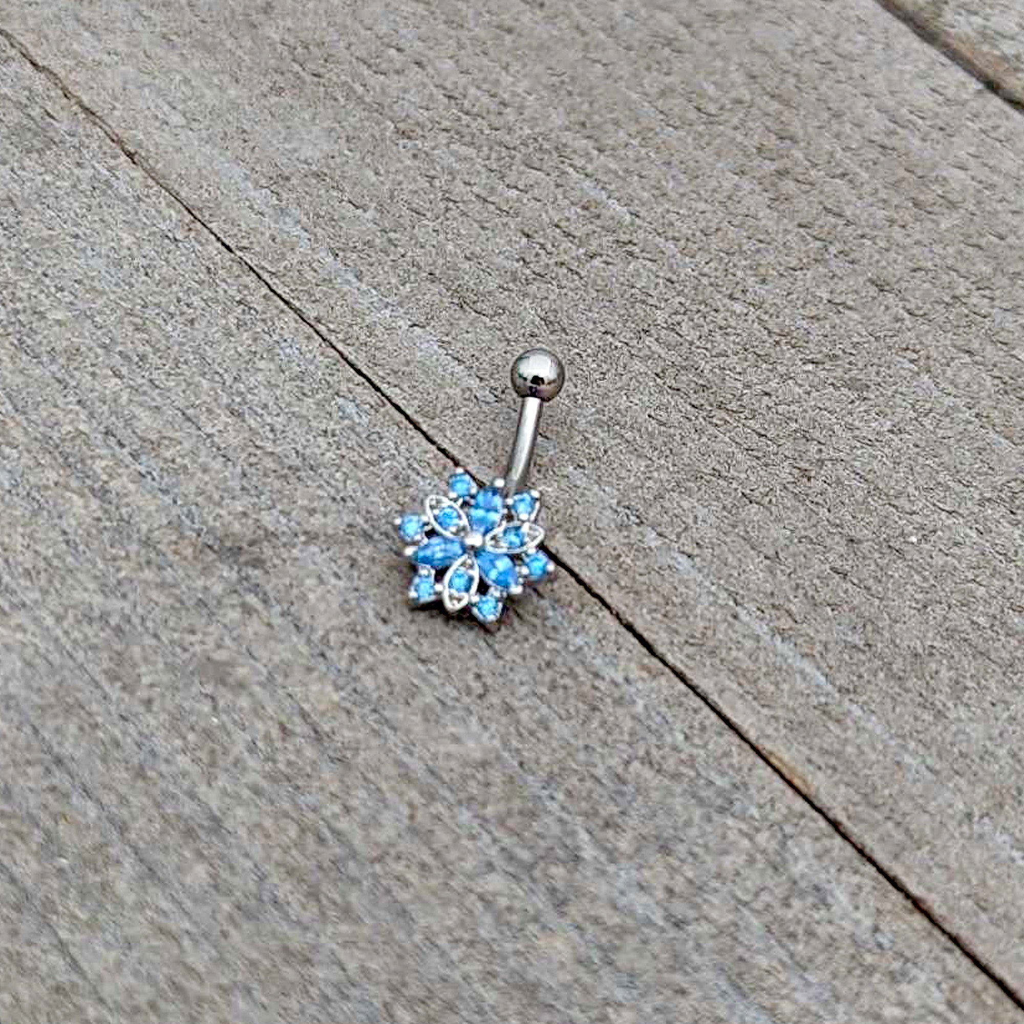 16 Gauge 5/16 Blue CZ Gem Snowflake Blues Curved Eyebrow Ring