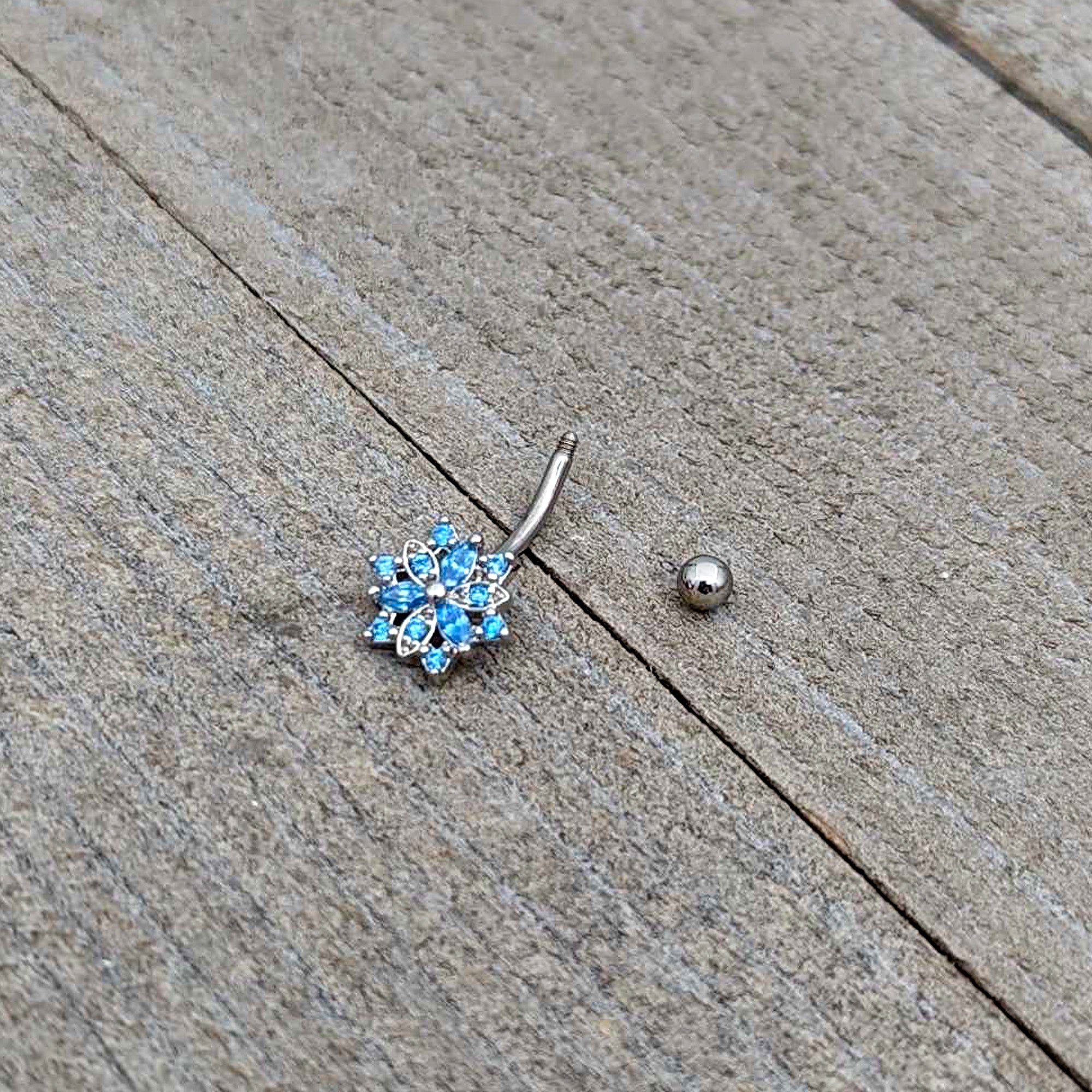 16 Gauge 5/16 Blue CZ Gem Snowflake Blues Curved Eyebrow Ring