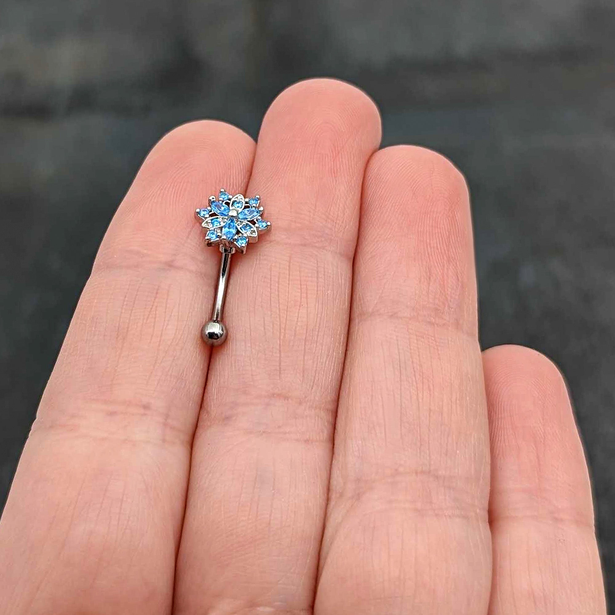 16 Gauge 5/16 Blue CZ Gem Snowflake Blues Curved Eyebrow Ring